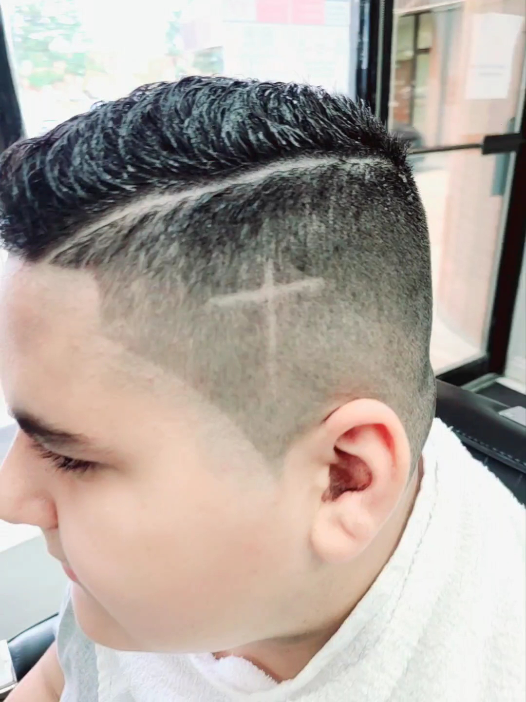 Kids fade with a hair design at Kamal Barber Shop