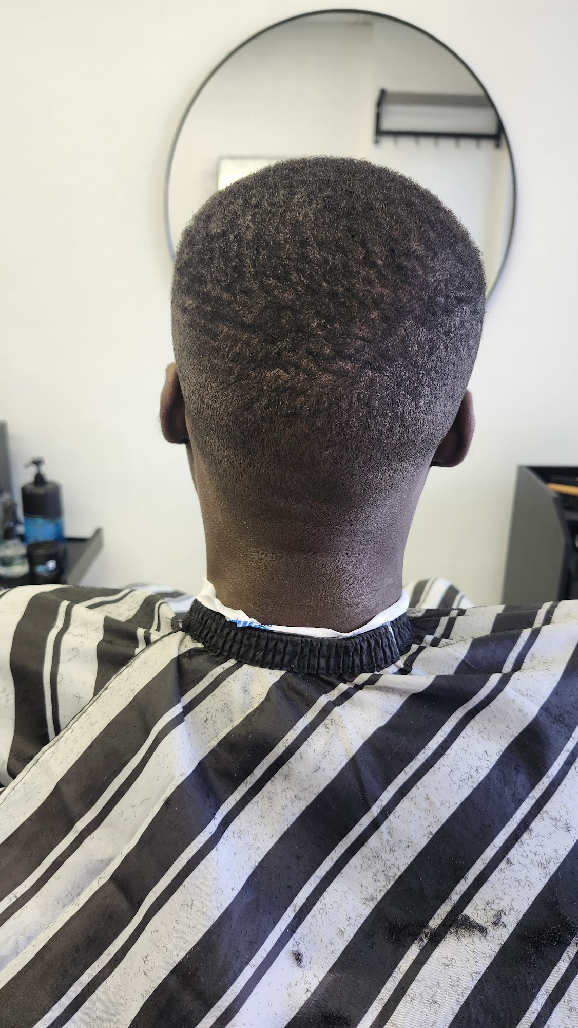 Clean fade, back view, at Kamal Barber Shop