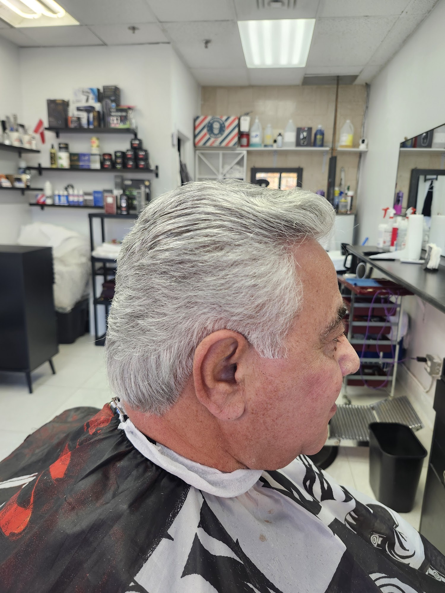 Client in the chair at Kamal Barber Shop