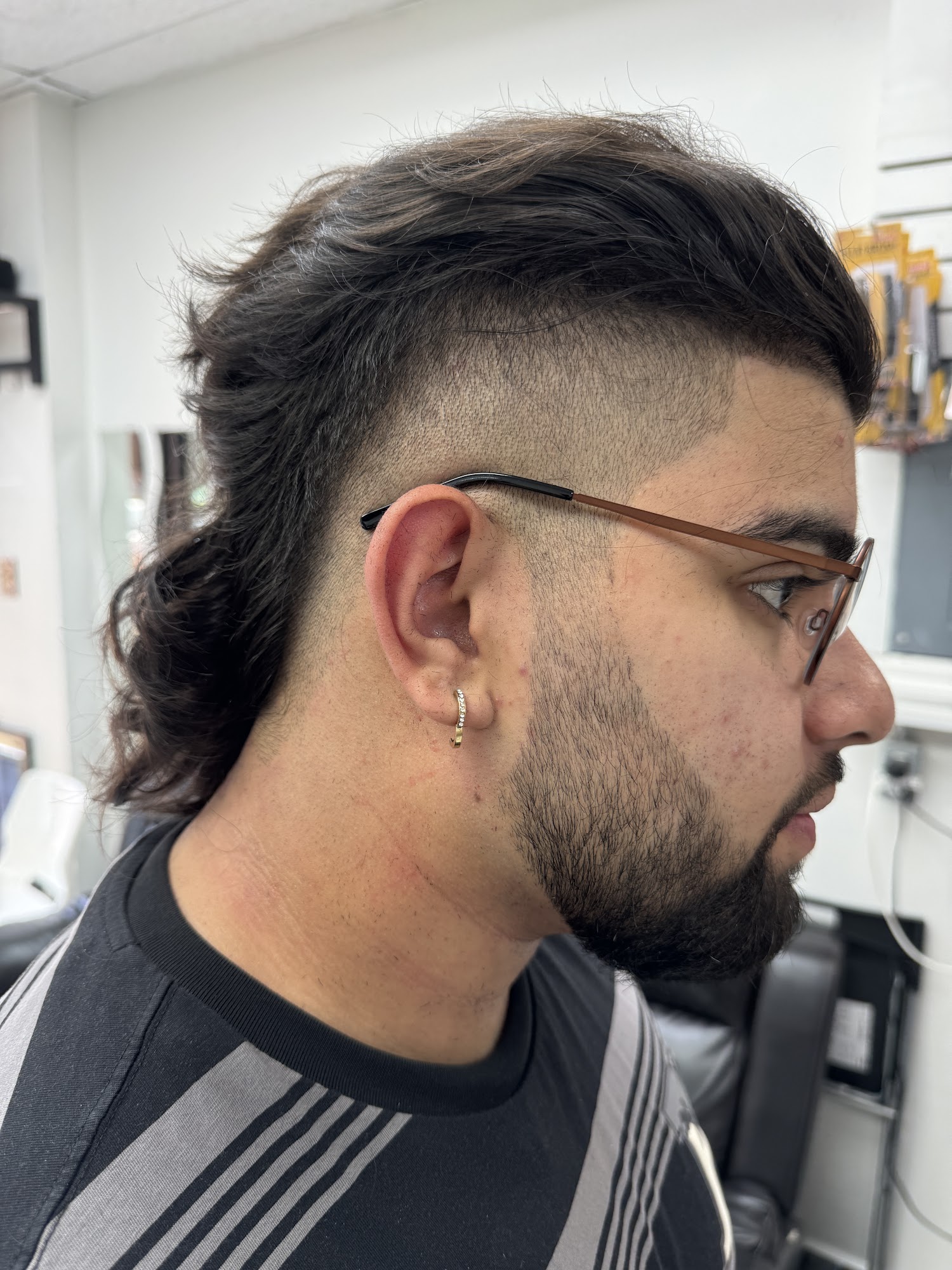 Modern fade with length on top at Kamal Barber Shop